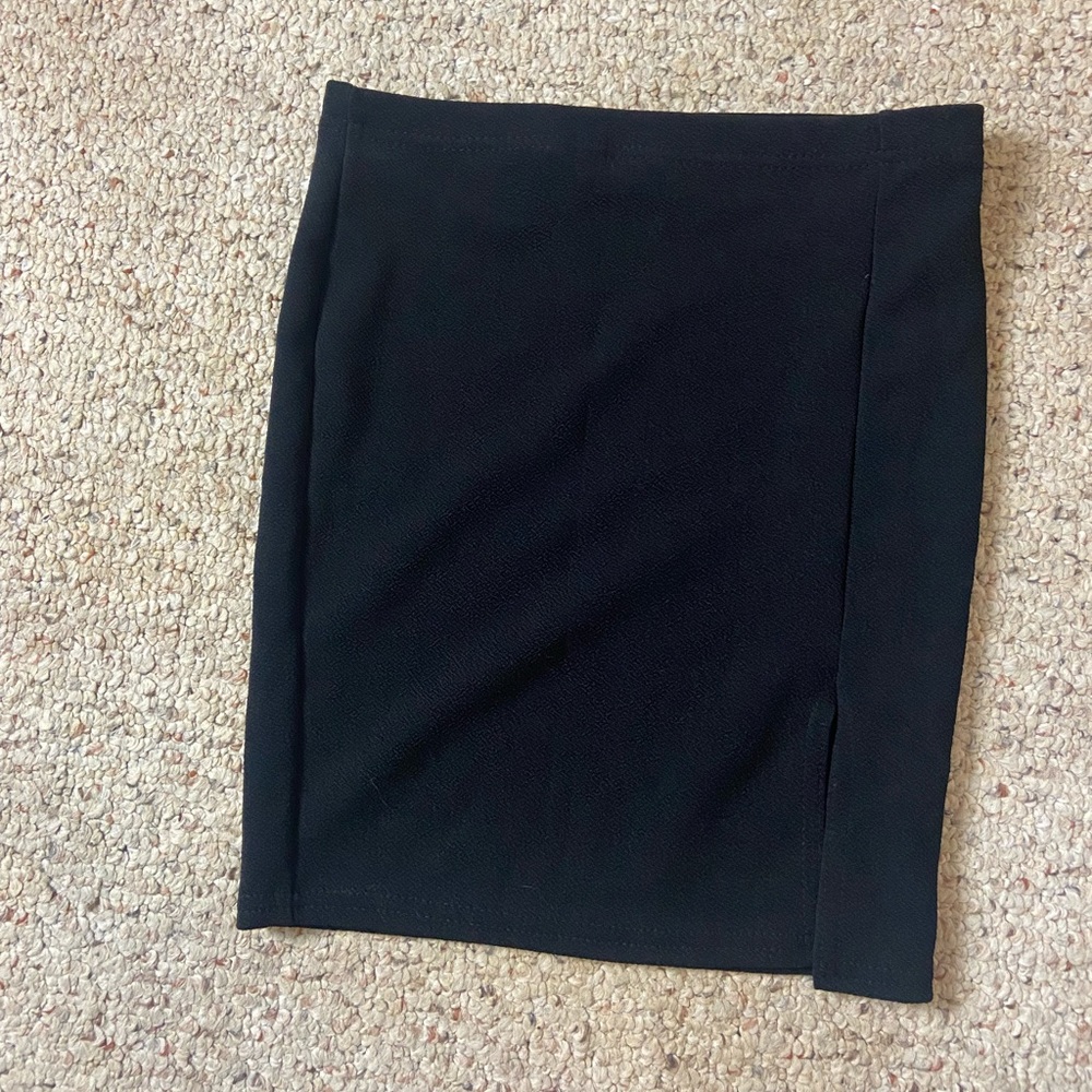 Tight fitting formal skirt with a small slit